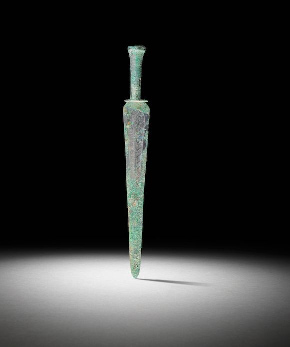 Bonhams : An archaic bronze long slender triangular sword Late Eastern ...