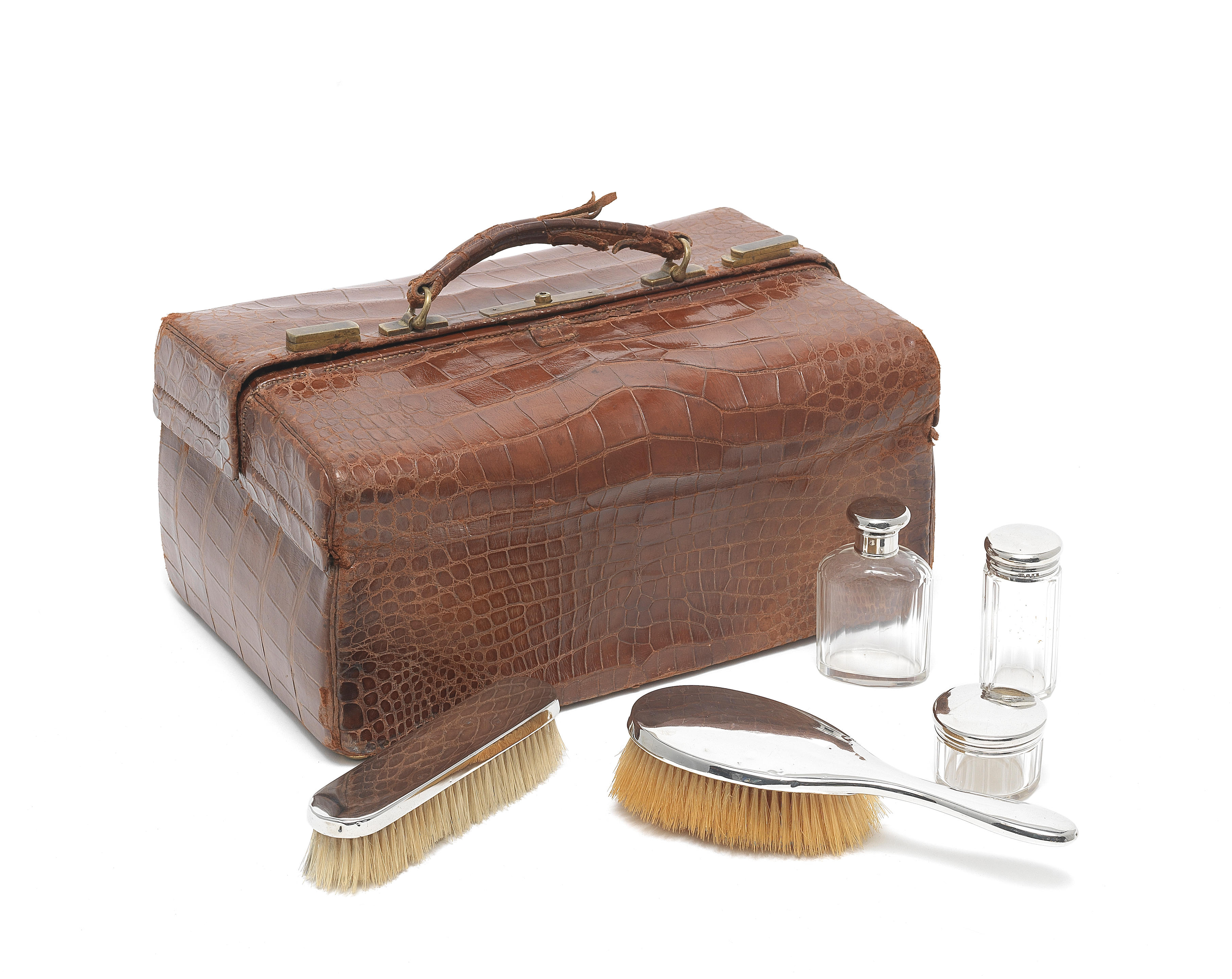 A 20th century brown crocodile leather 'Gladstone' vanity case with...