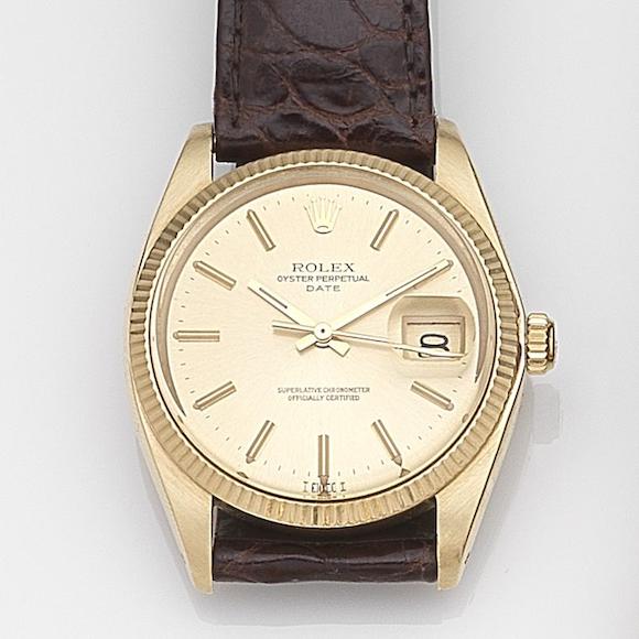 Bonhams Rolex. An 18ct gold automatic calendar wristwatch Date