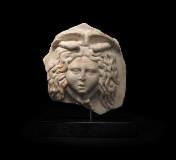 Bonhams : A Roman marble relief fragment of Medusa