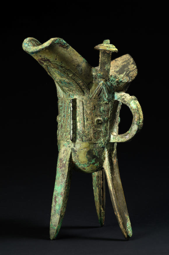 Bonhams : A fine archaic bronze tripod pouring vessel, jue Shang Dynasty