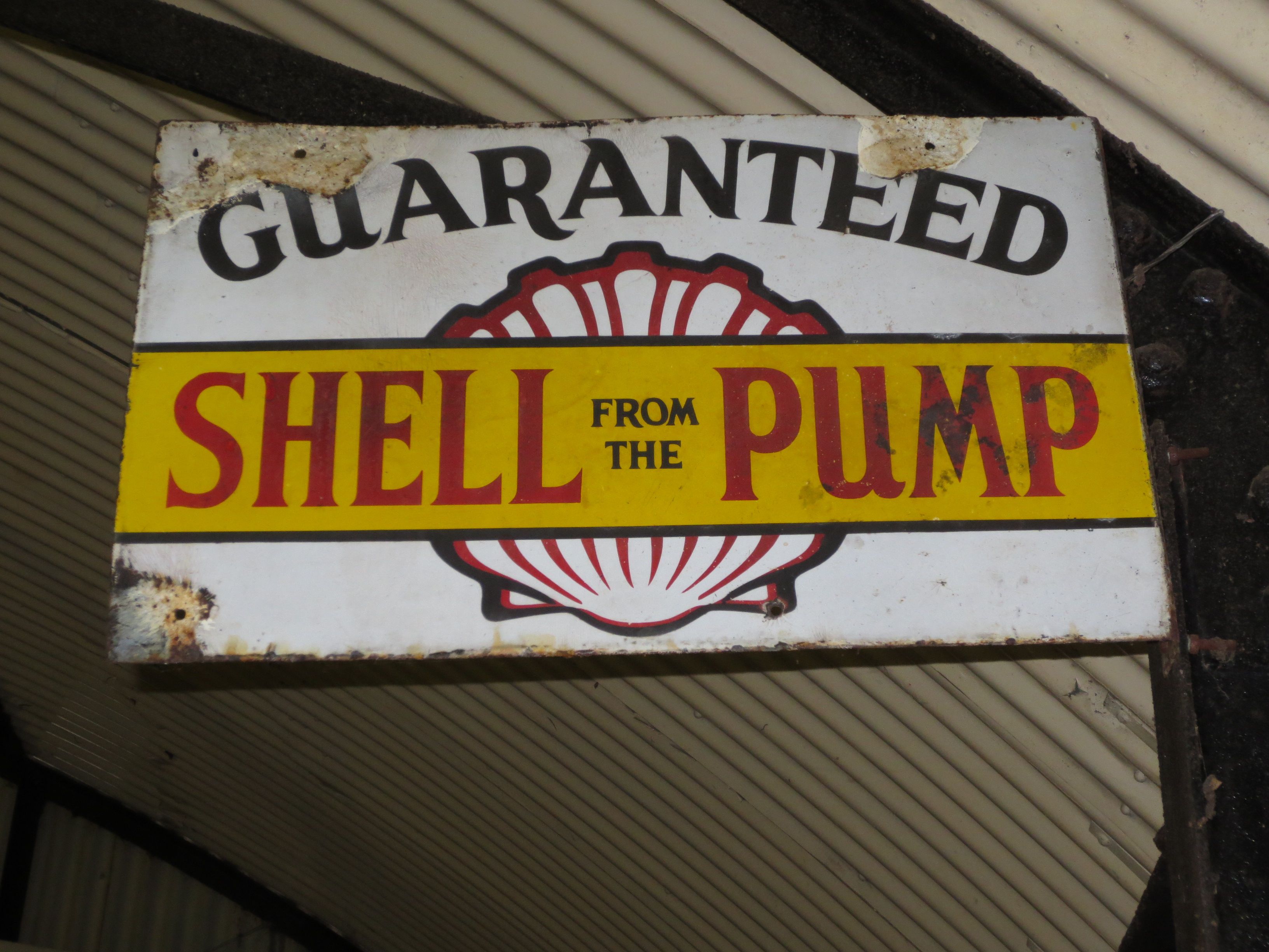 Bonhams Cars : A 'Guaranteed Shell from the Pump' enamel sign,