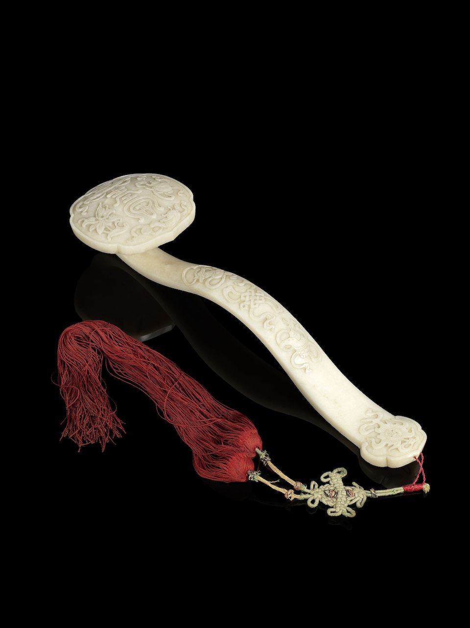 A 'chicken-bone' jade 'Eight Buddhist Emblems' ruyi 19th century