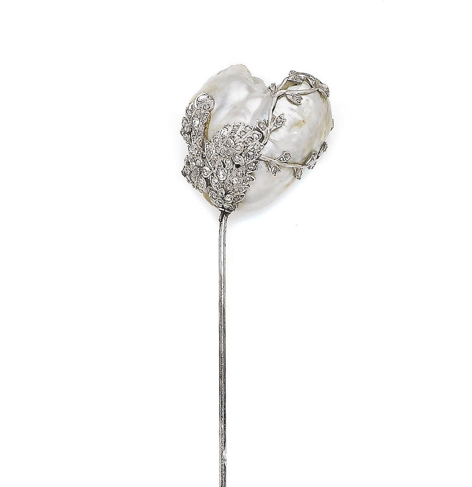 Bonhams : A diamond-set natural baroque pearl hat pin,