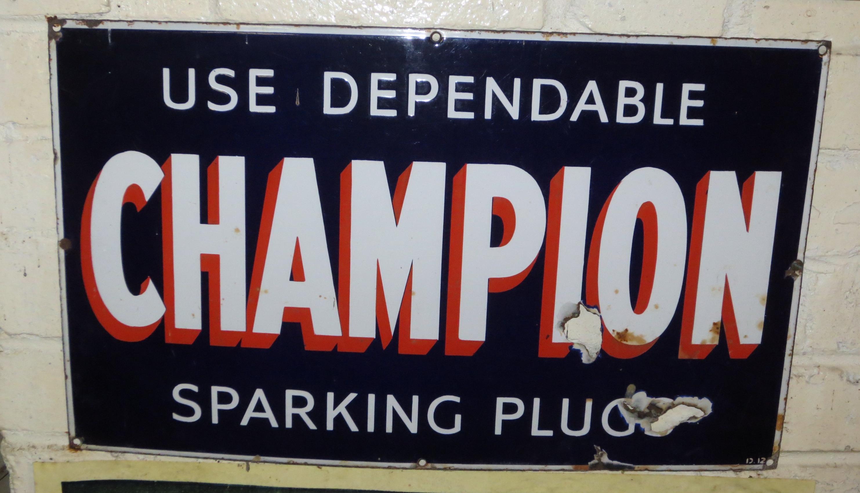 Bonhams Cars : A Champion Sparking Plugs enamel sign,