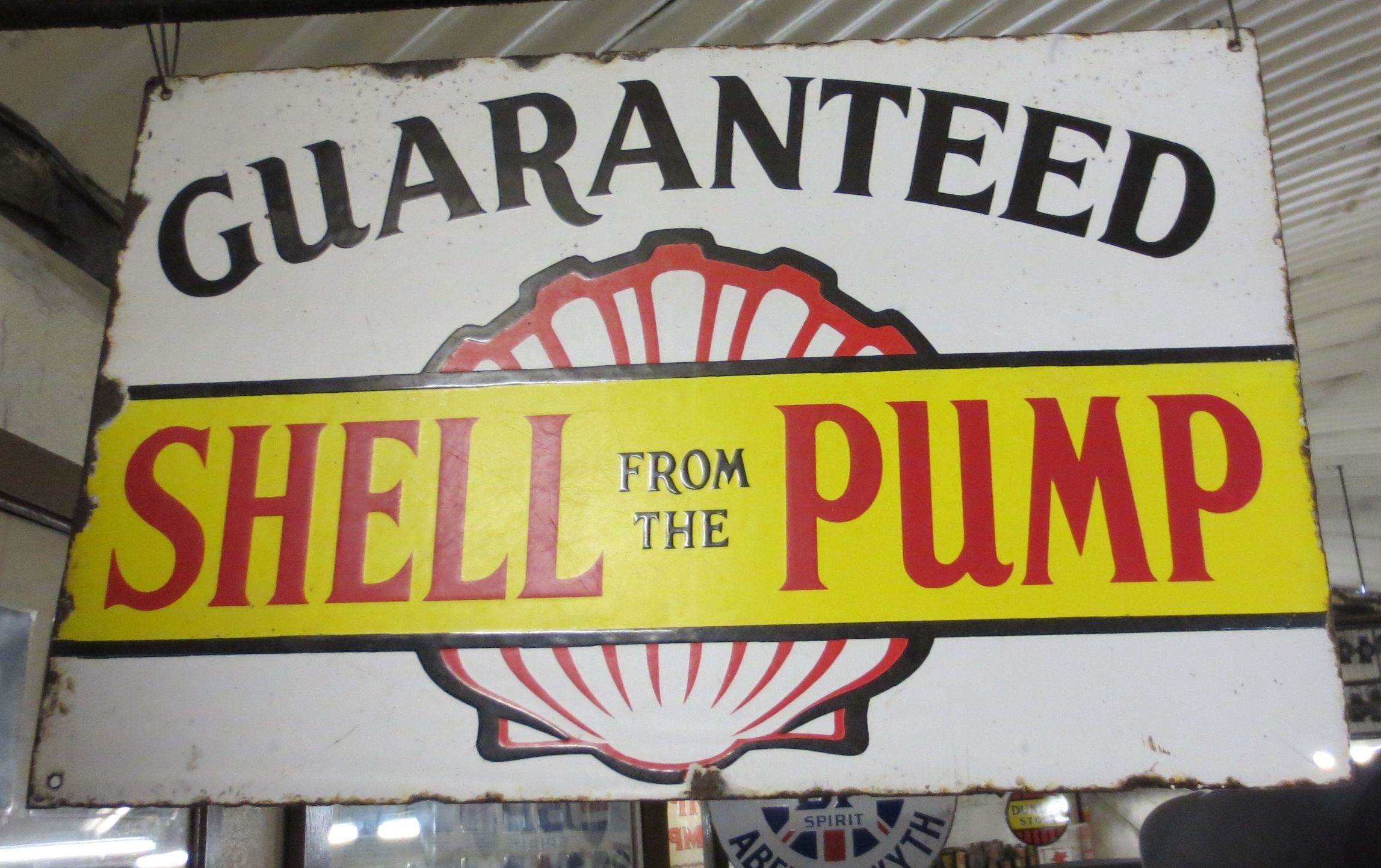 Bonhams Cars : A 'Shell from the Pump Guaranteed' enamel sign,