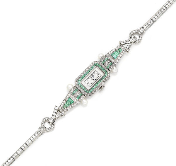 Bonhams : An emerald and diamond wristwatch,