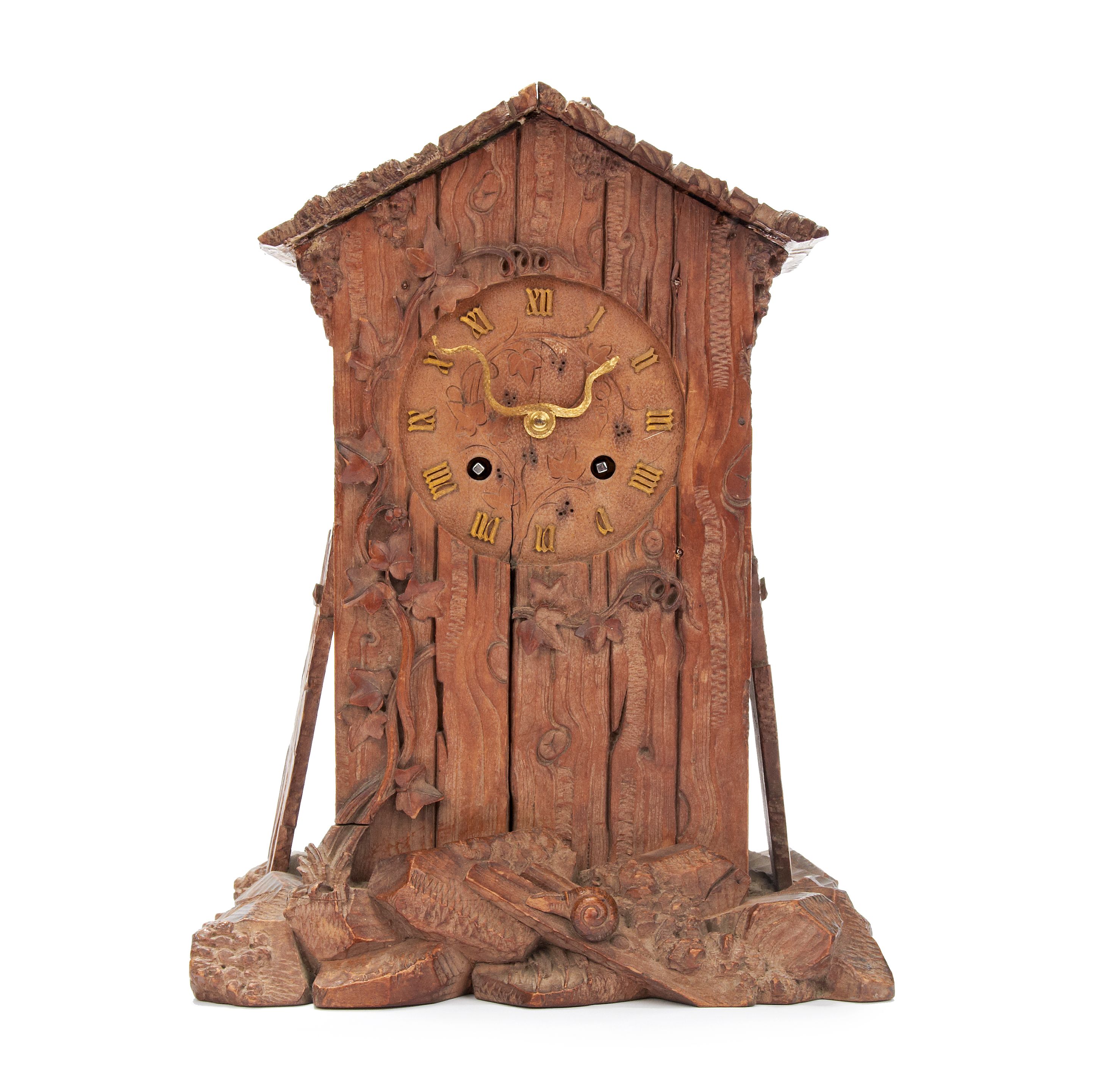 Bonhams A late 19th Century Arts and Crafts carved wooden mantel clock
