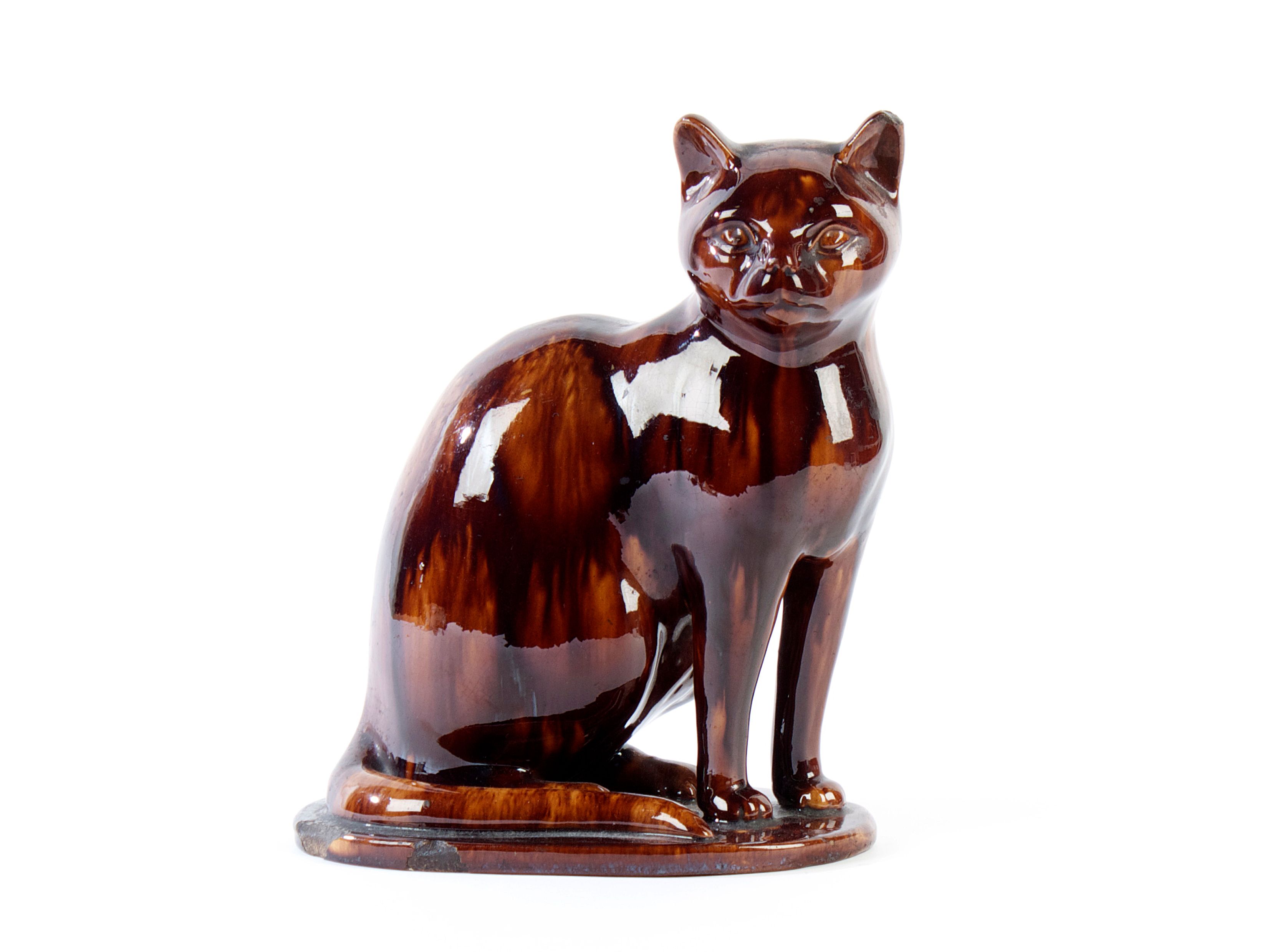 Bonhams A large treacleglaze figure of a cat, perhaps Canney Hill