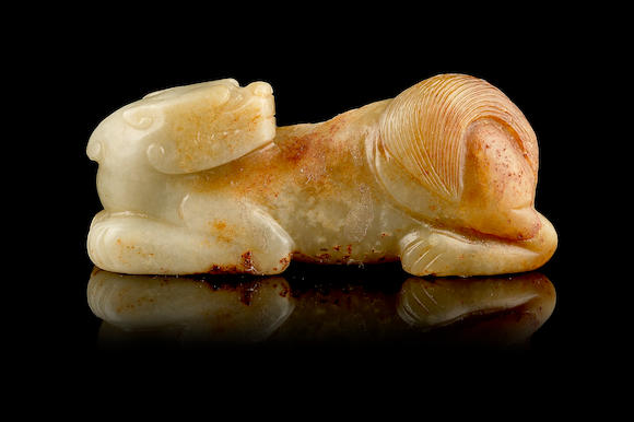 Bonhams : A green and russet jade recumbent beast Ming Dynasty or later