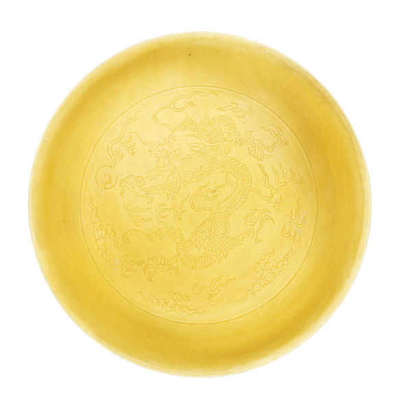 Bonhams : A yellow-glazed incised 'dragons' saucer dish Daoguang seal ...