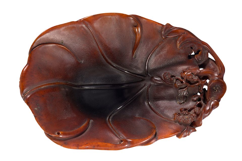 A finely carved 'floral' rhinoceros horn libation cup 18th century