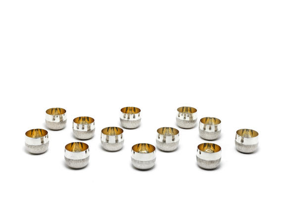 Bonhams : GERALD BENNEY A set of twelve silver tumblers London 1991 ...