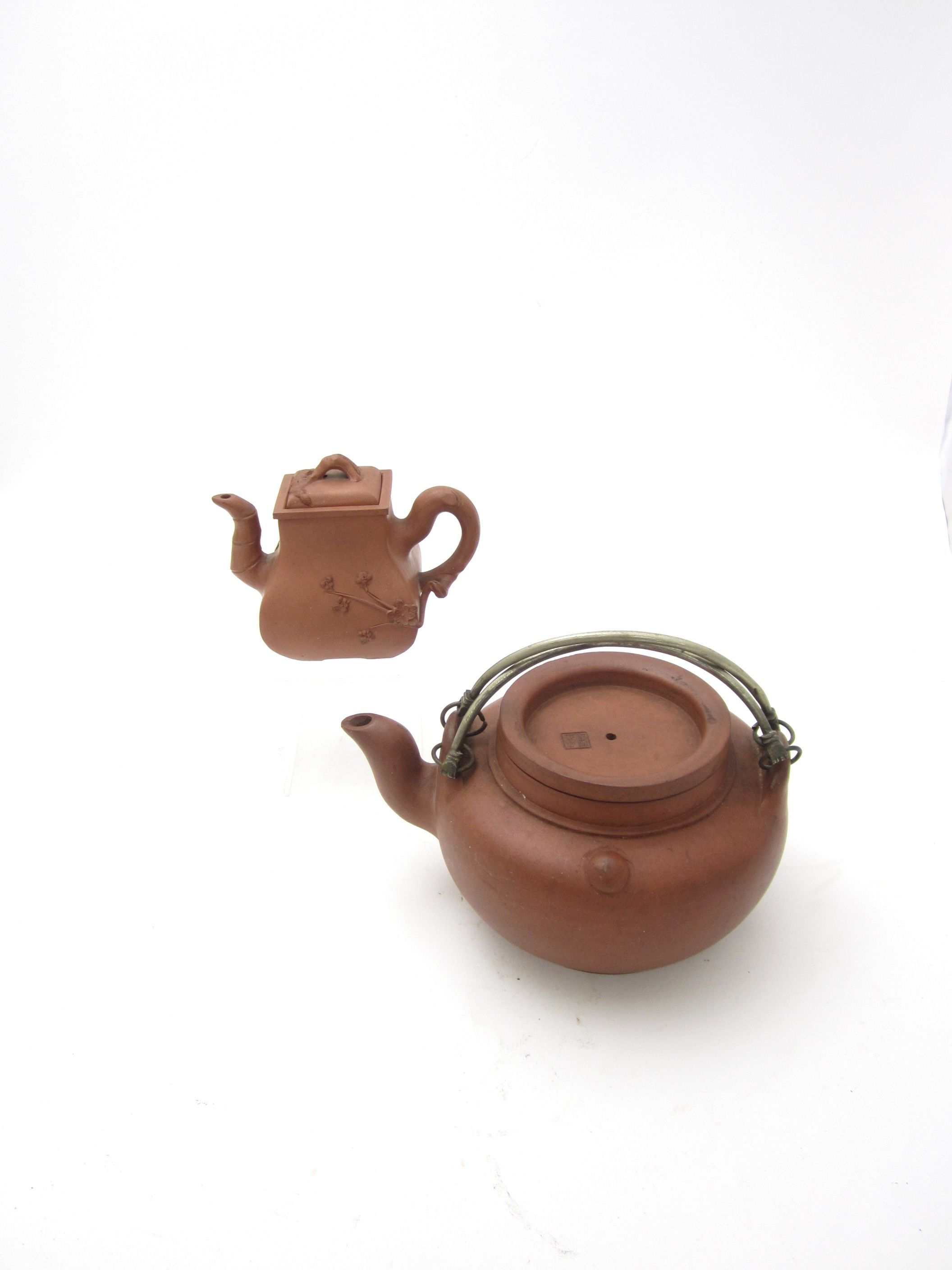 Two Yixing teapots