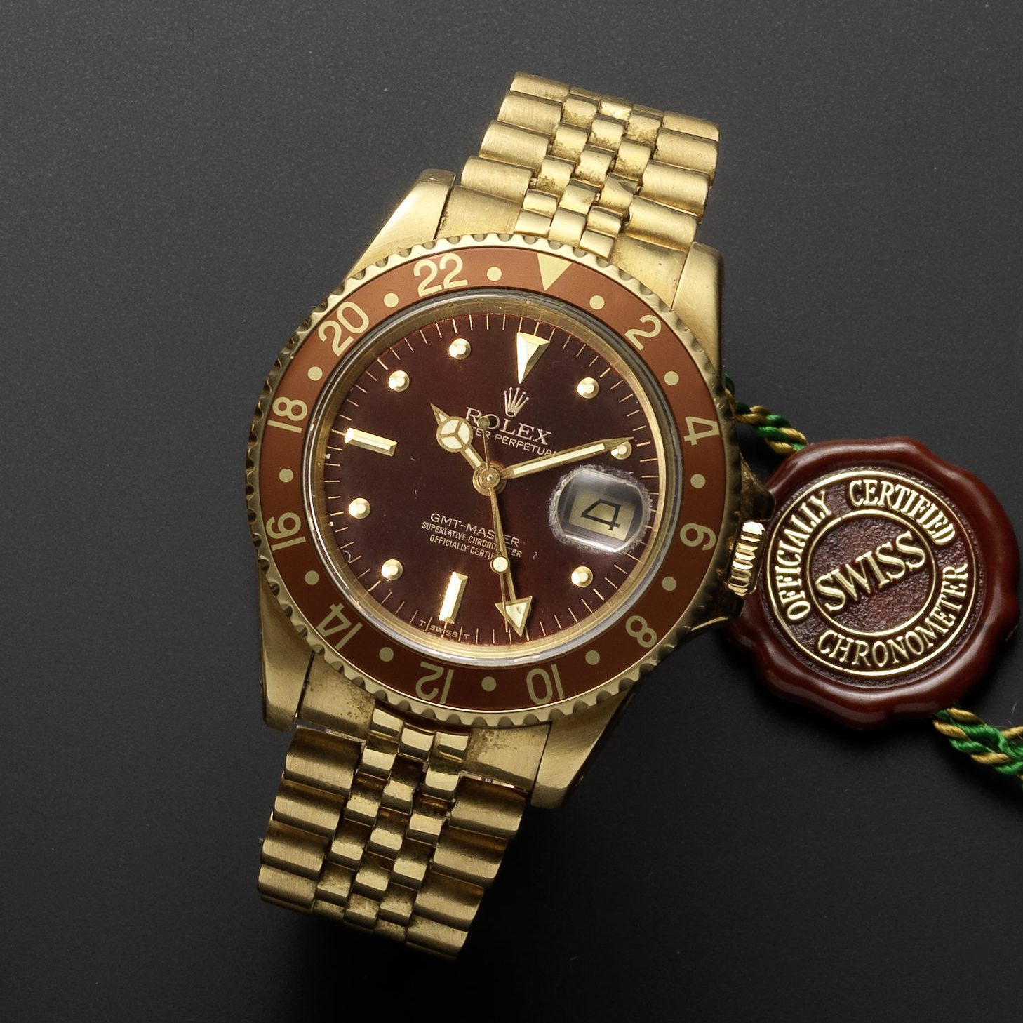 Rolex Rolex. A fine 18ct gold automatic calendar bracelet watch with dual timezone and 'root beer' bezel GMT Master, Ref:16758, Serial No.7077***, Movement No.072****, Circa 1981 · 16758