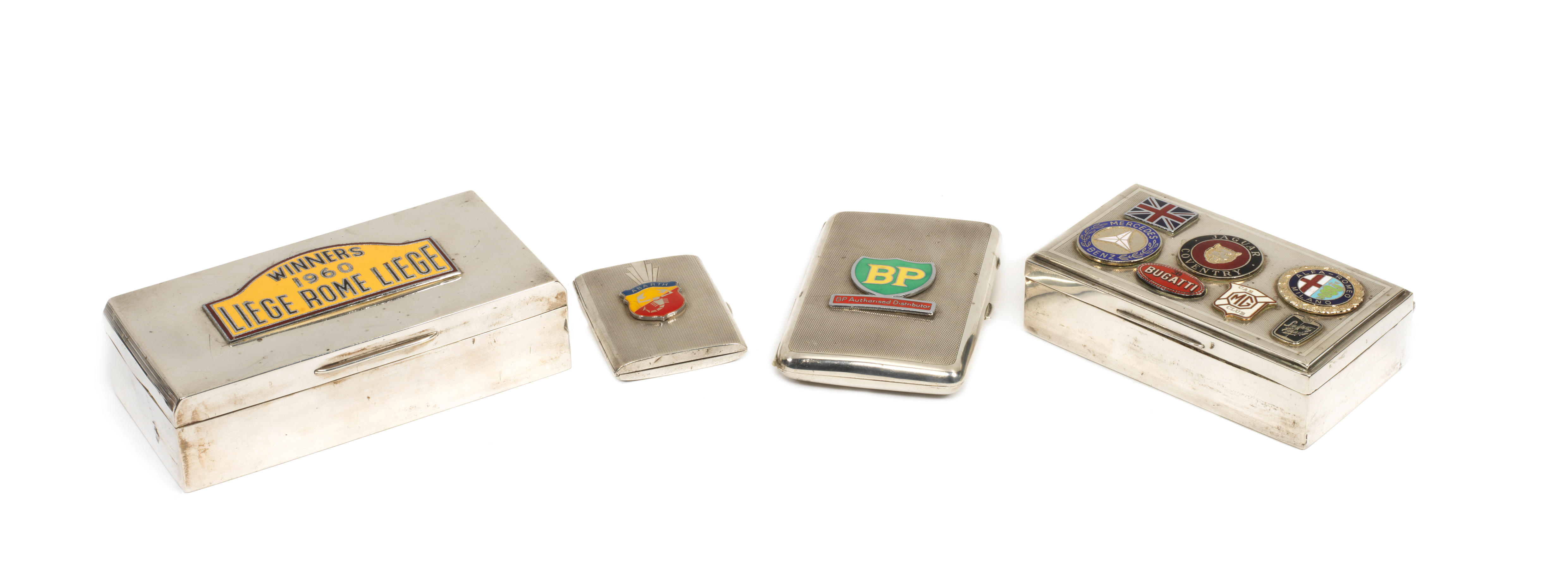 Bonhams Cars : Four Silver Cigarette Boxes And Cases Applied With 