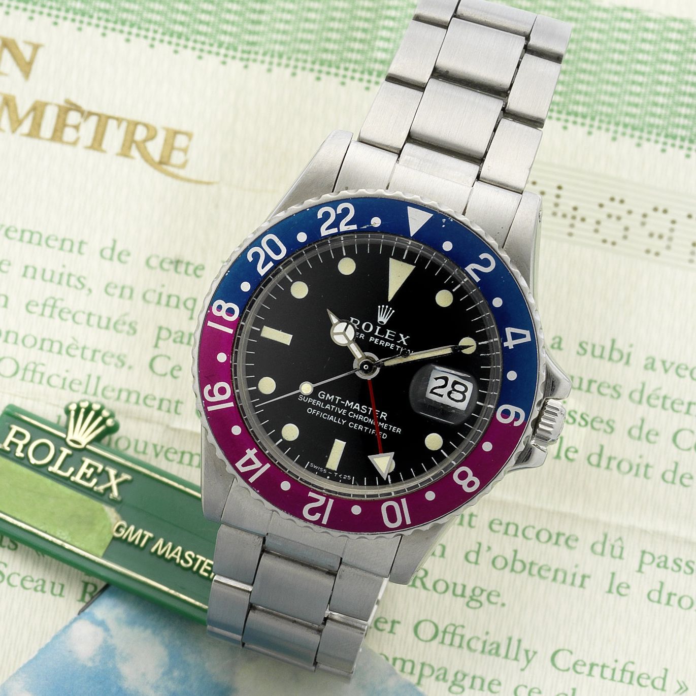 Rolex Rolex. A rare stainless steel automatic calendar bracelet watch with dual time-zone indication, together with chronometer and guarantee certificates GMT-Master, Ref:1675, Serial No. 28489***, Sold 9th July 1972 · 1675