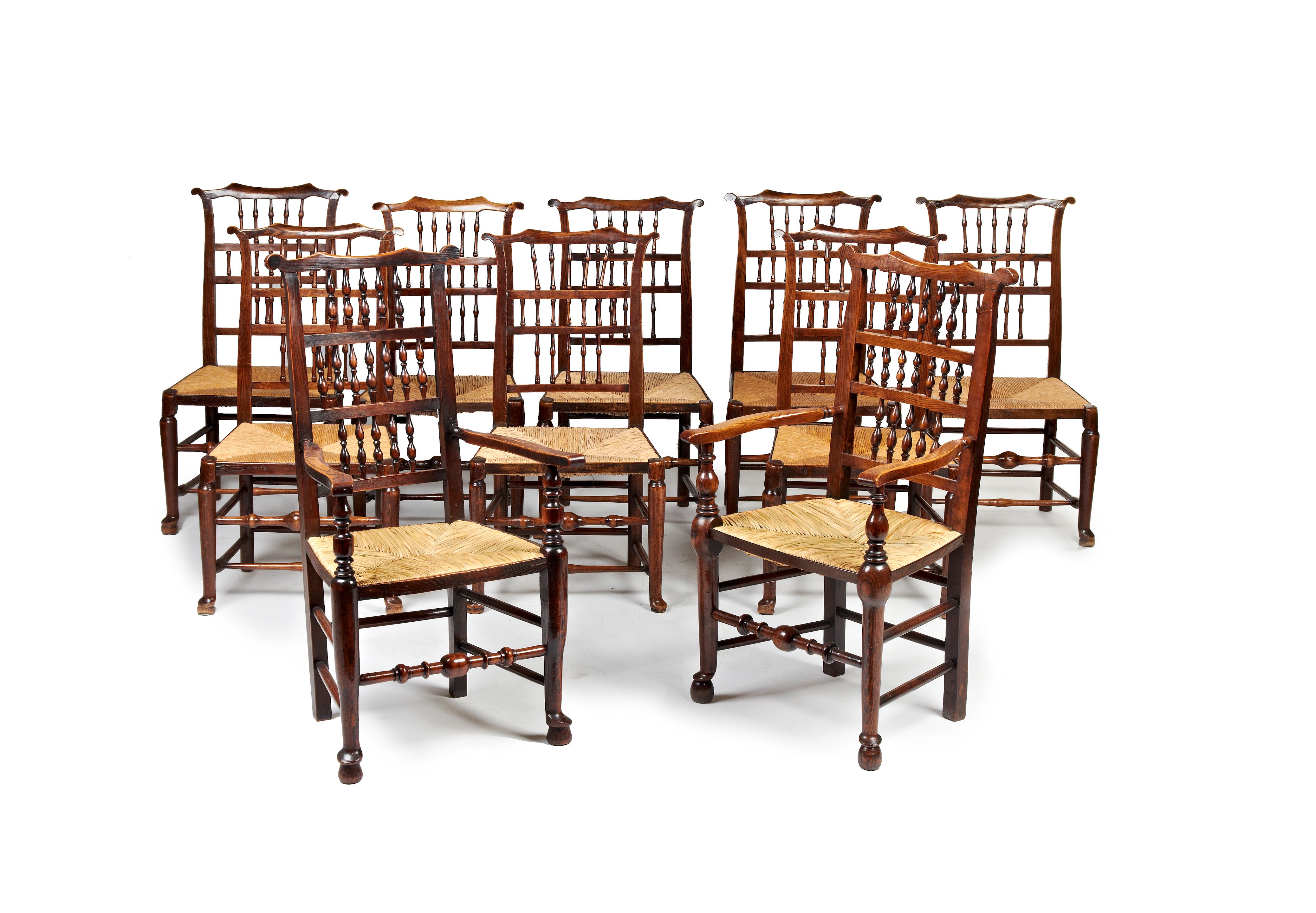 Bonhams A harlequin set of ten early 19th century eared spindleback