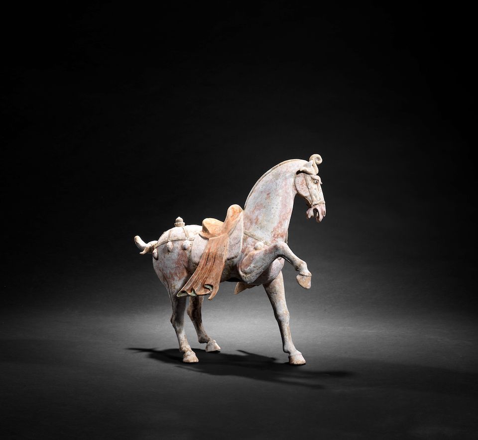 A large painted pottery model of a prancing horse Tang Dynasty