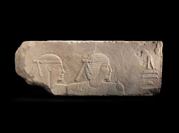 Bonhams : An Egyptian limestone relief of a husband and wife
