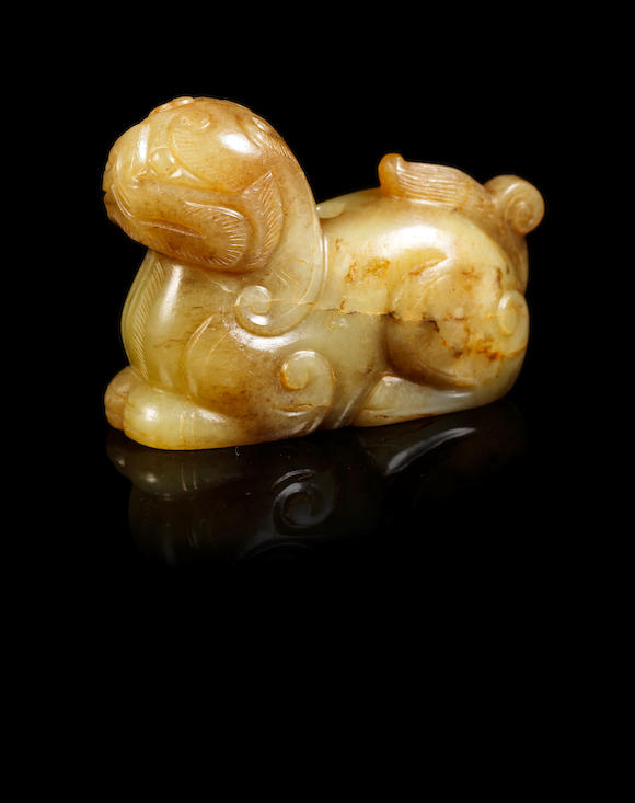 Bonhams : A yellow jade carving of a mythical beast