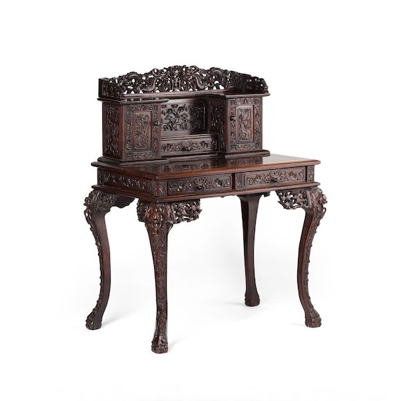 Bonhams : An ornately carved blackwood desk 19th century