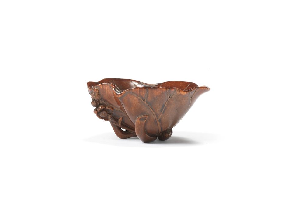 A rhinoceros horn 'lotus-leaf' libation cup 18th century (2)