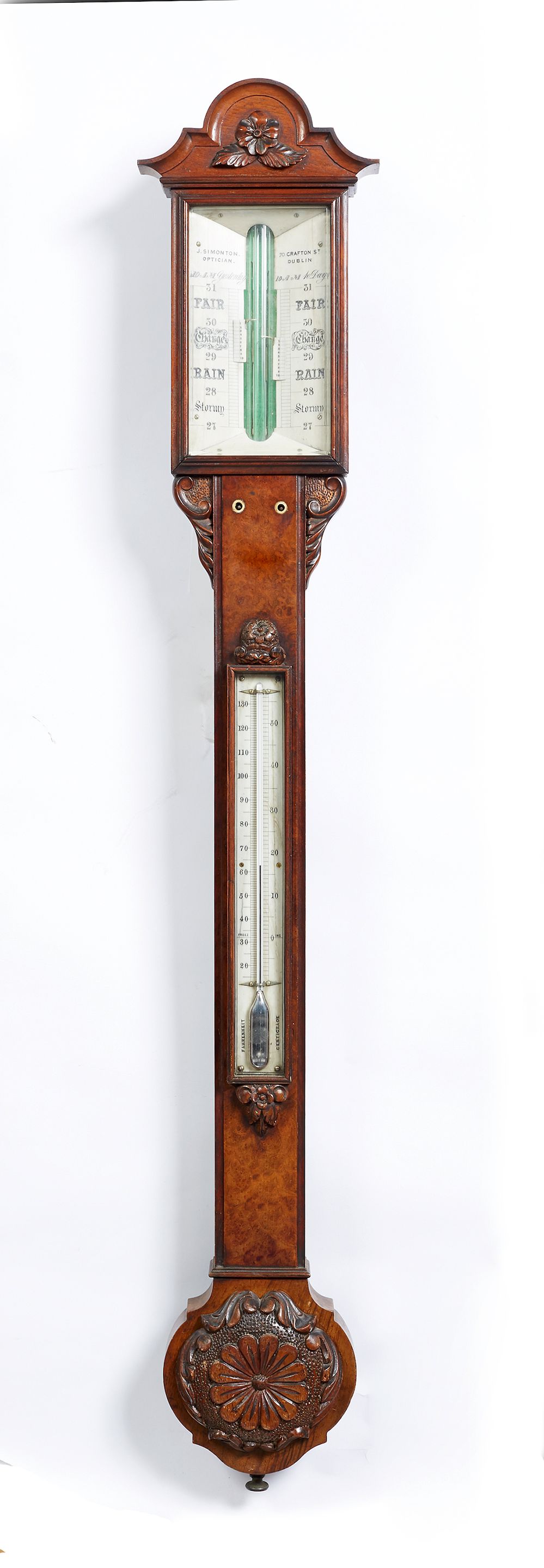 A Victorian walnut stick barometer