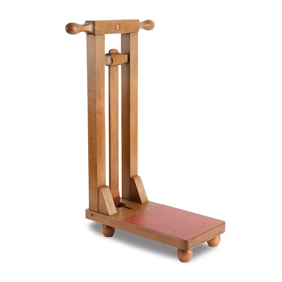 Bonhams A 20th century beech freestanding Boot jackBy Peal & Co., London