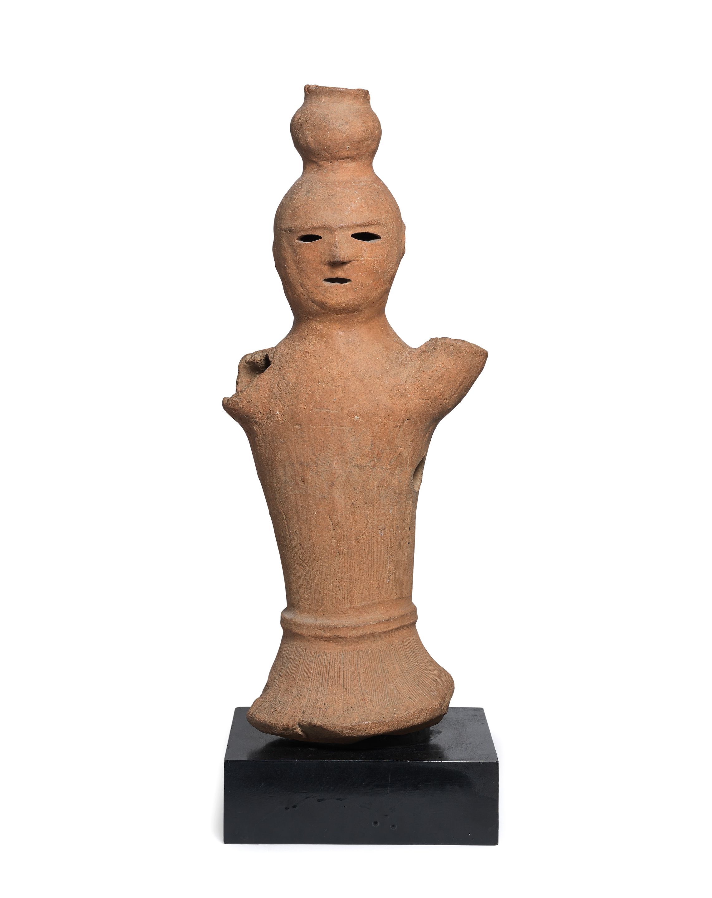 Bonhams A Rare Haniwa Figure of a Figure with a Jar Kofun period (3rd