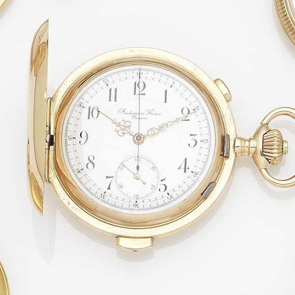 Bonhams Audemars Frères, Genève. A 14k gold keyless wind minute