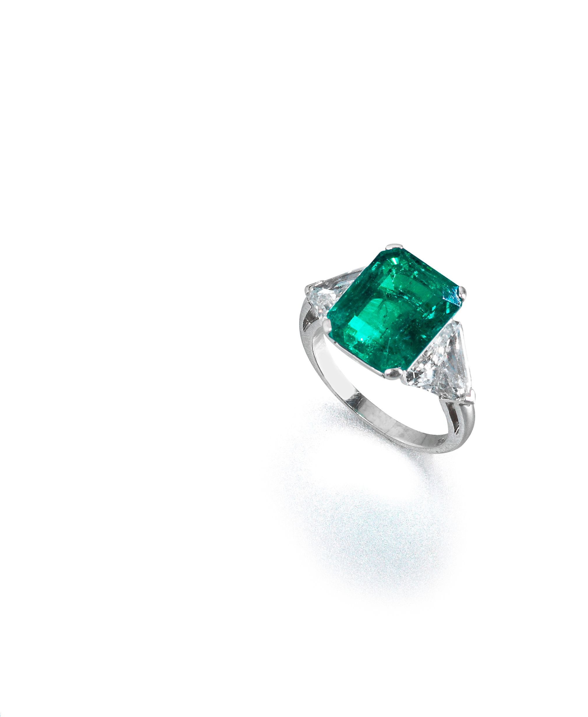 An emerald and diamond ring