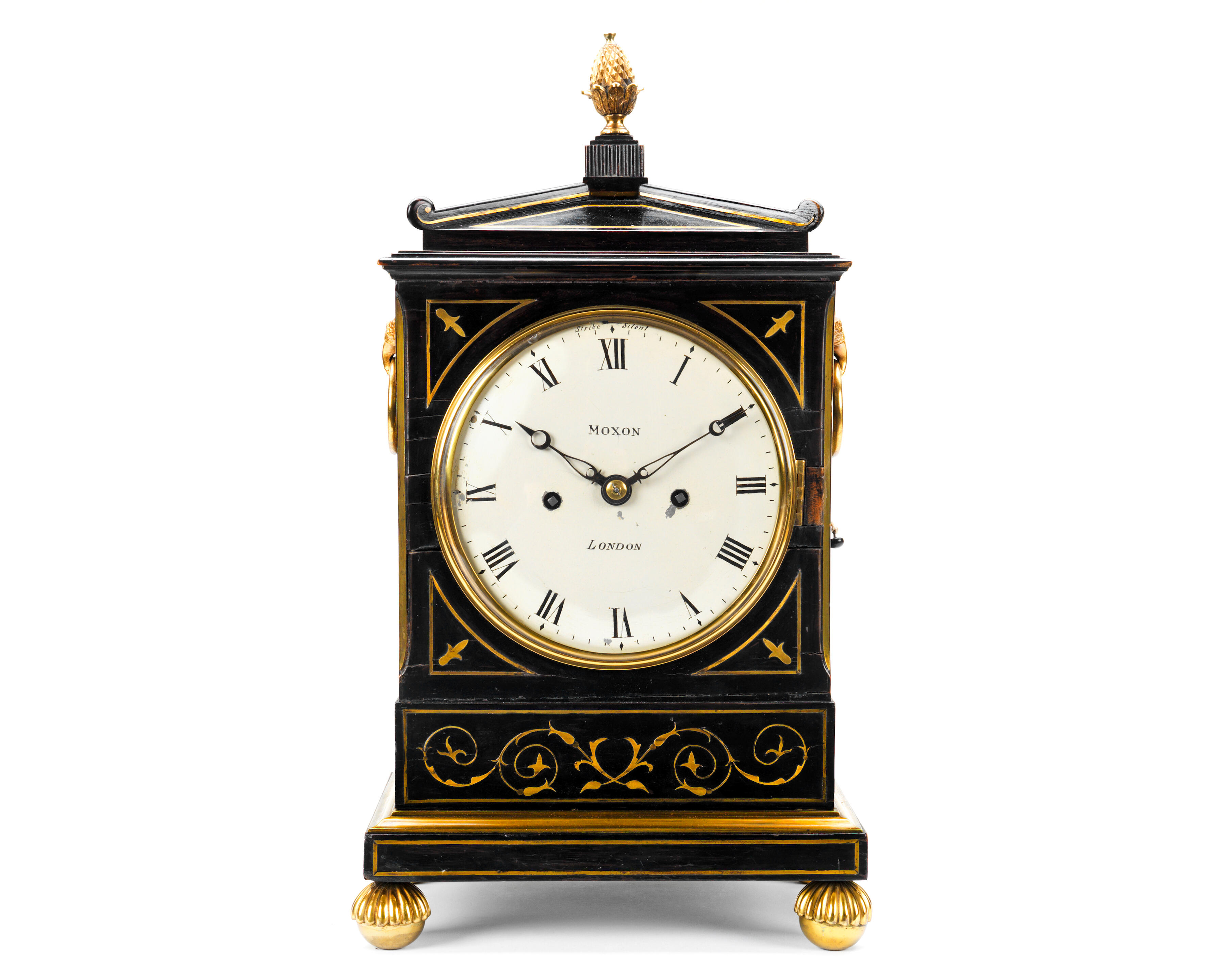 Bonhams A Regency ebonised and brass inlaid fusee table clock the