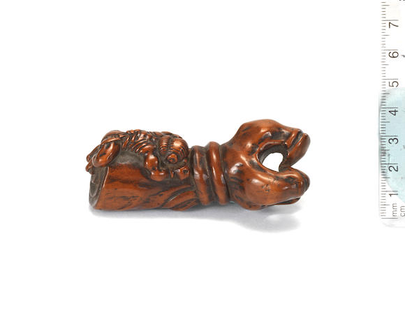 Bonhams : A wood netsuke of a demon on the arm of the Rashomon demon ...