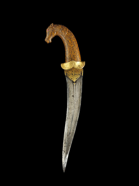 Bonhams : A fossil-stone hilted koftgari steel Dagger North India, 17th ...