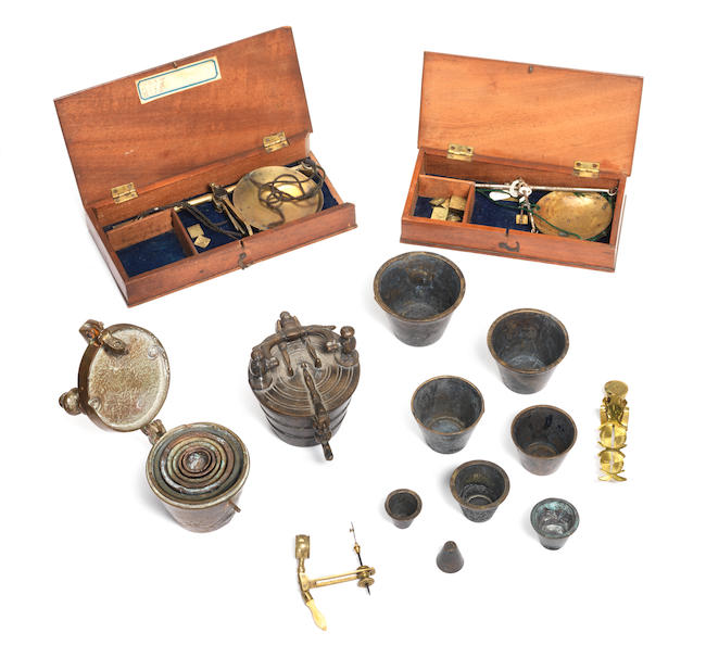Two sets of brass cup weights, (6)
