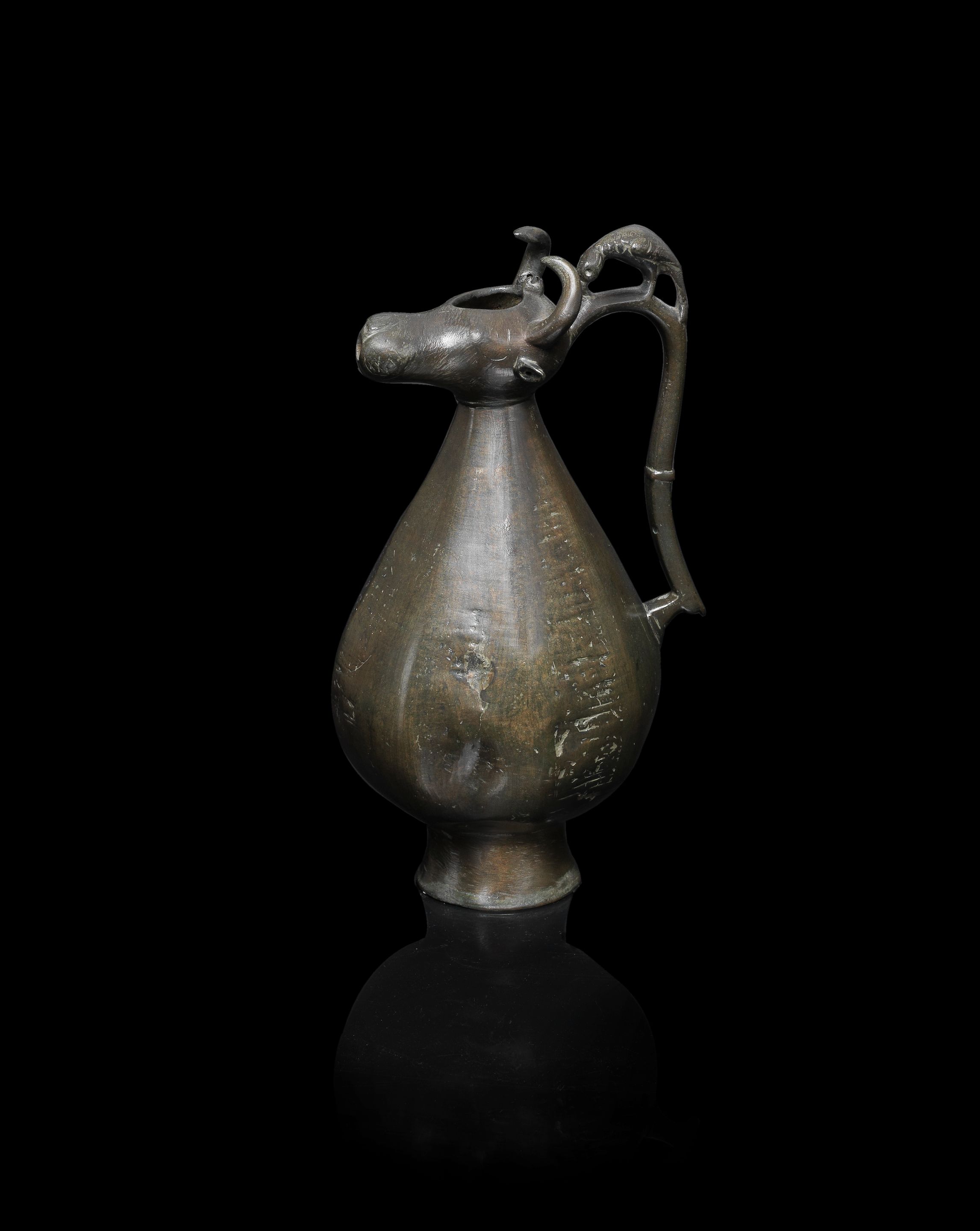 Bonhams A Khorasan bronze bull's head ewer Persia, 12th/ 13th Century