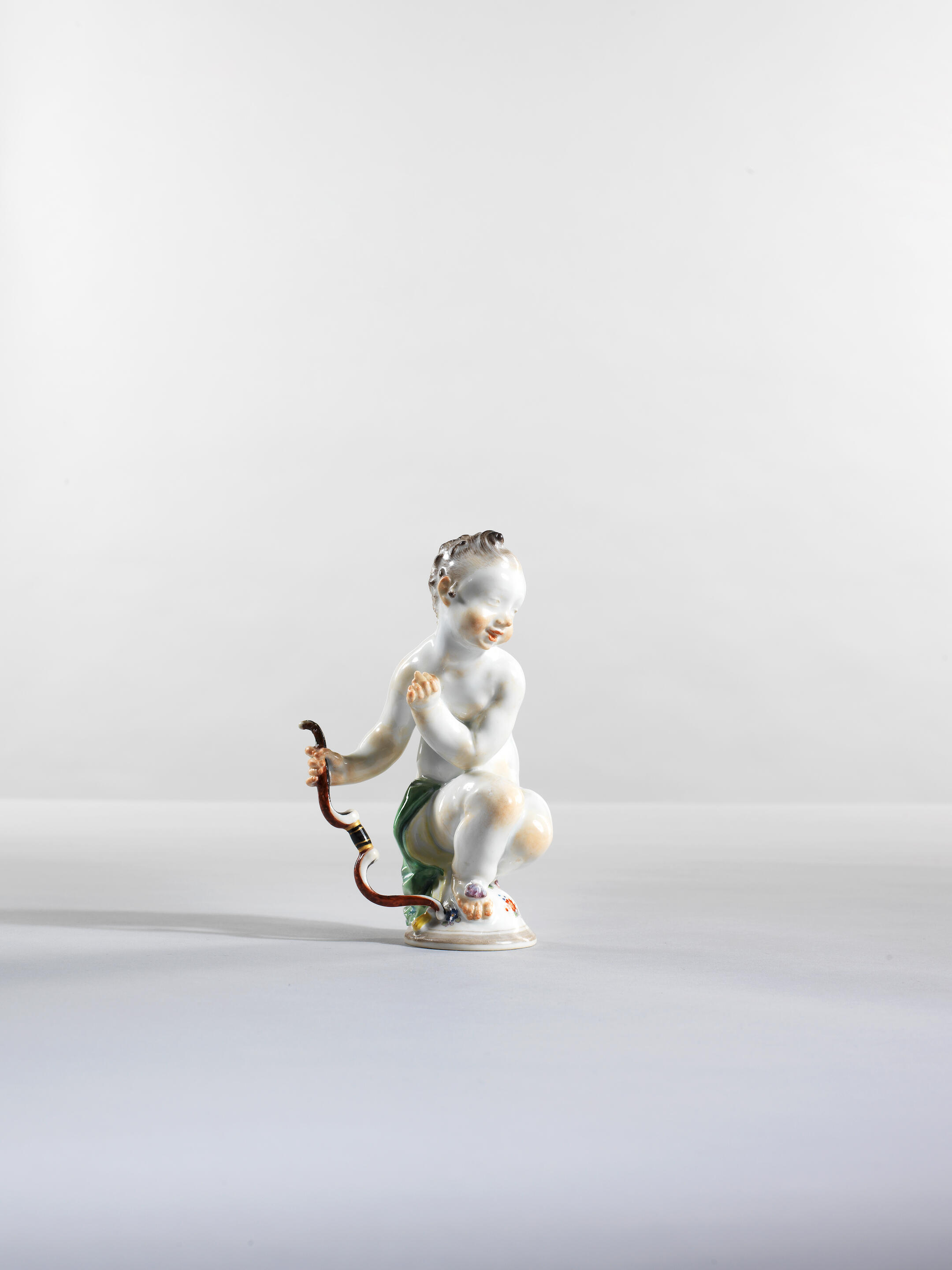 Putto en porcelaine, Meissen, circa 1920, E.A 5/11 A Meissen figure of a...