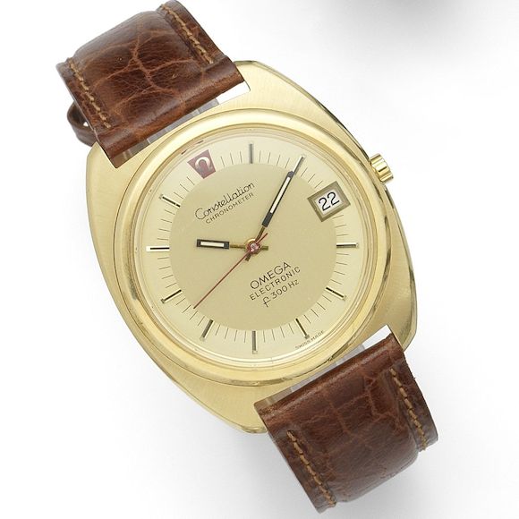 Bonhams : Omega. An 18K gold quartz electronic calendar wristwatch ...