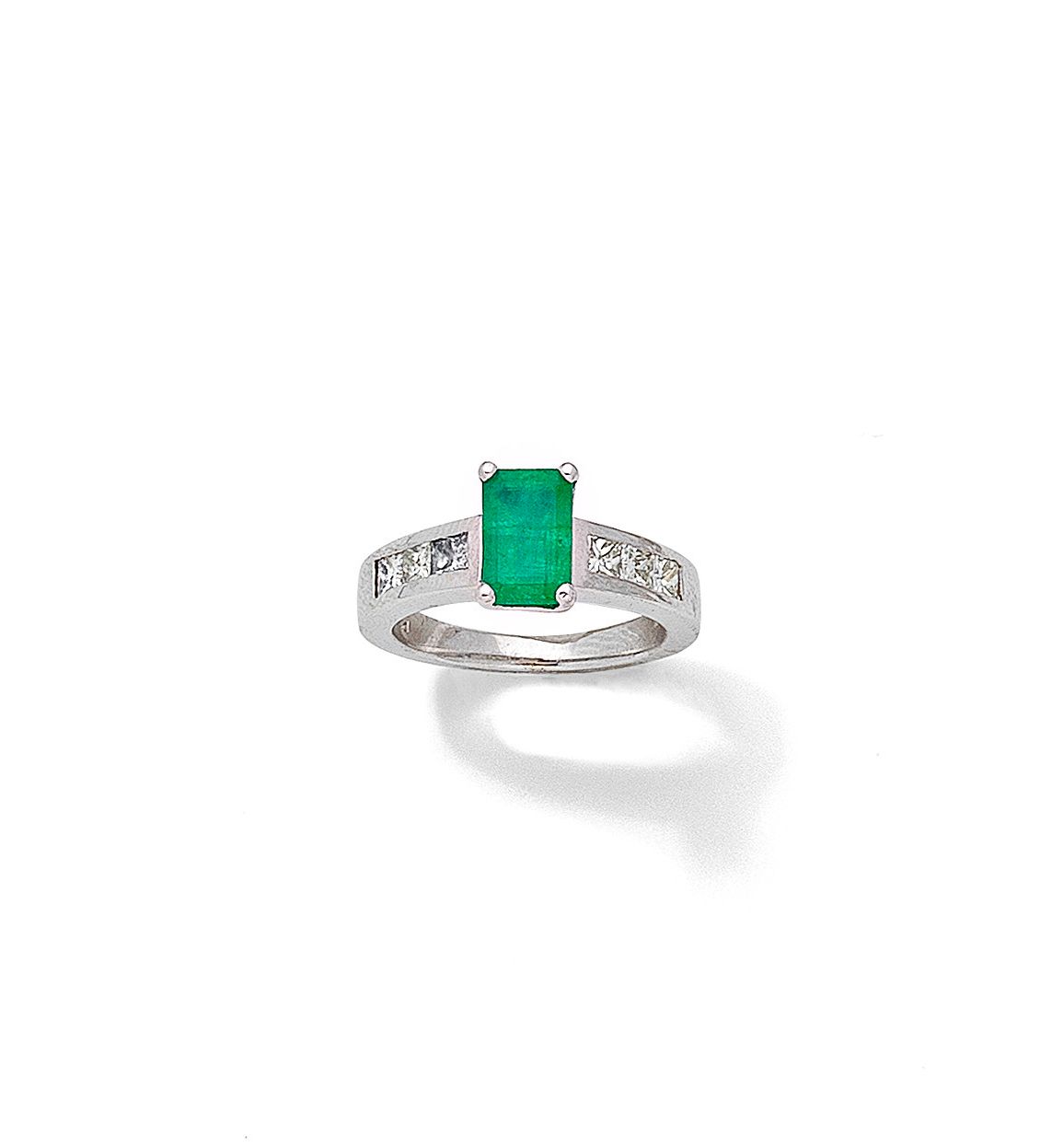 An emerald and diamond ring