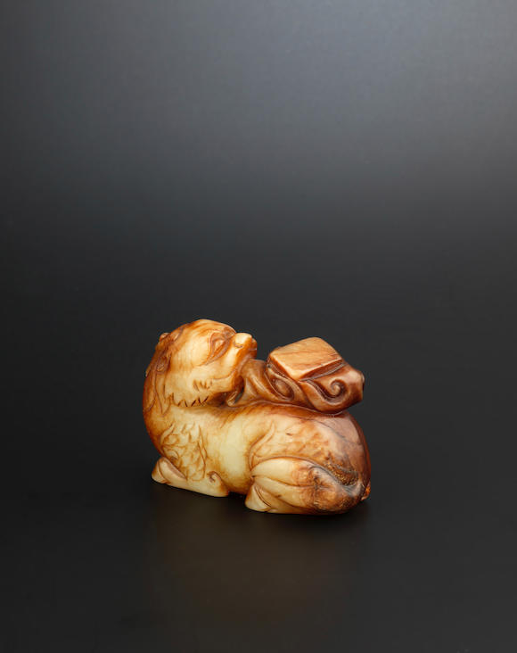 Bonhams : A pale green and russet jade carving of a qilin Early Ming ...