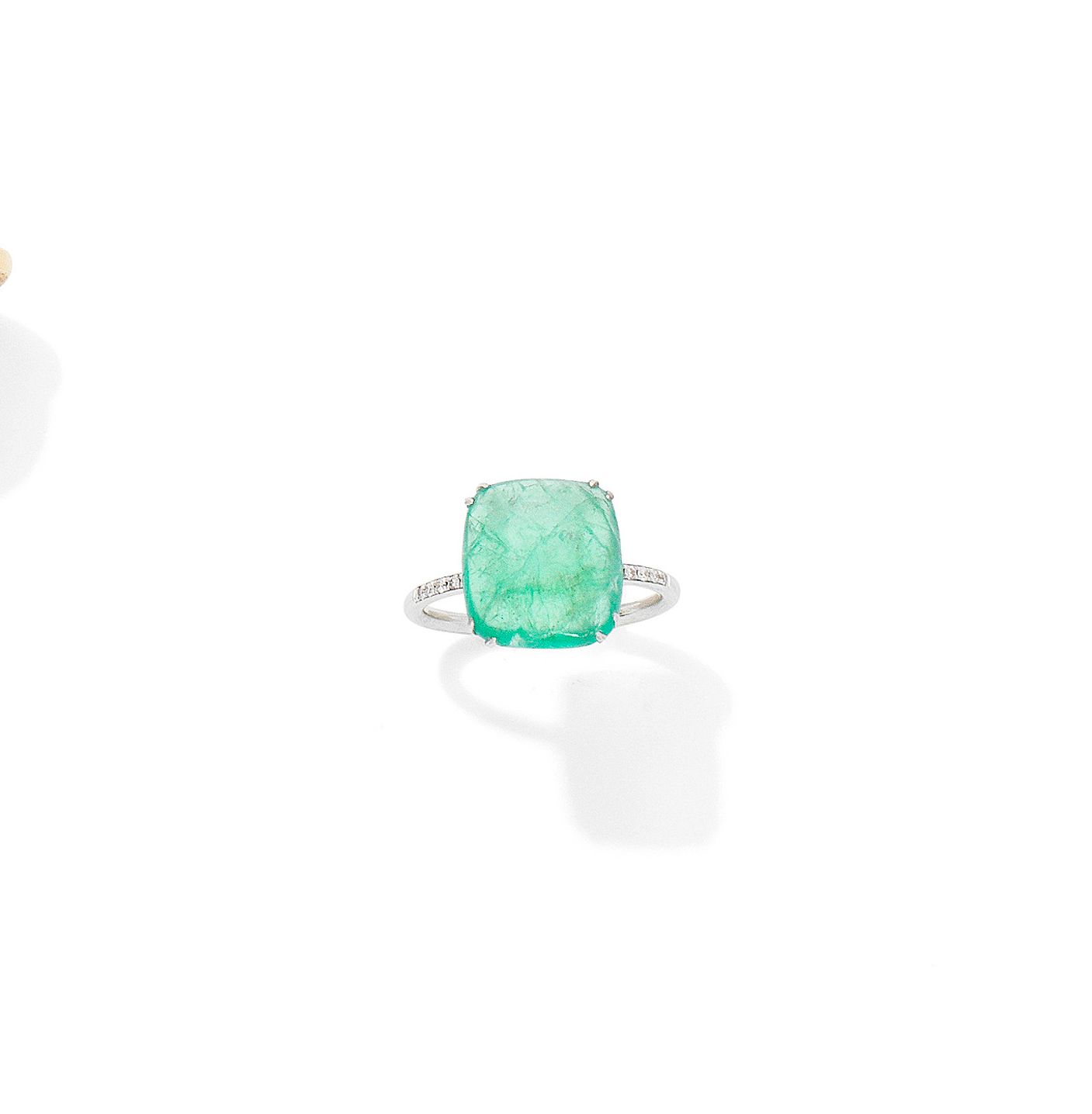 An emerald and diamond ring