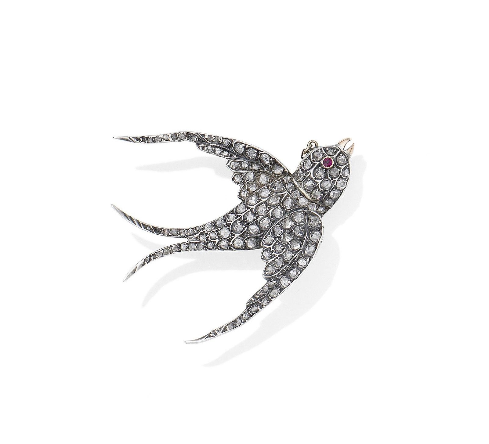 A diamond and ruby bird brooch,