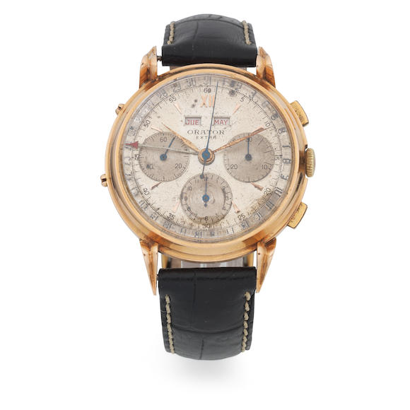 Bonhams Orator. An 18K gold manual wind triple calendar chronograph