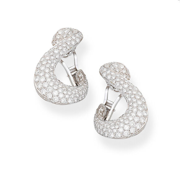 Bonhams : A pair of diamond scroll earrings