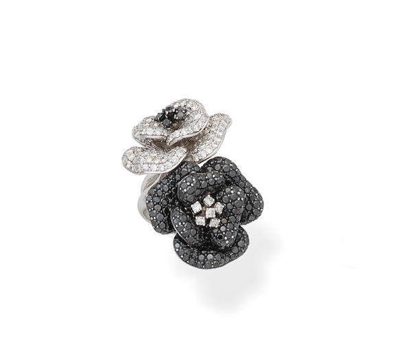 Bonhams : A diamond and black diamond flower ring