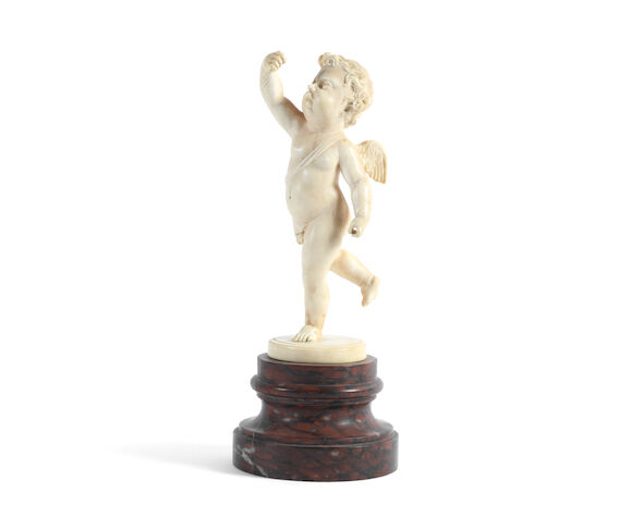 Bonhams : A late 19th century carved ivory figure of a putto mounted on ...