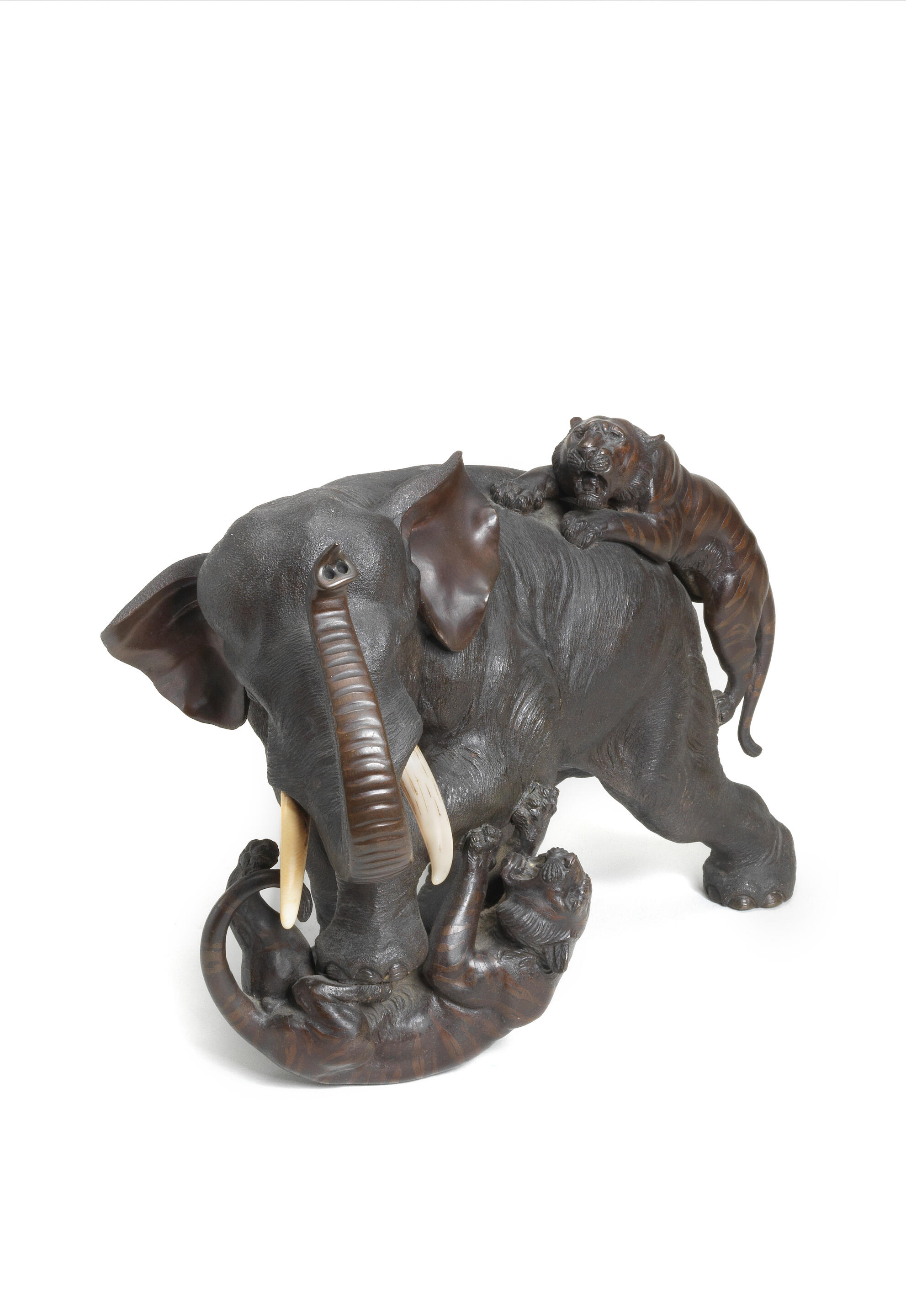 Bonhams A bronze okimono group of an elephant and two tigers By