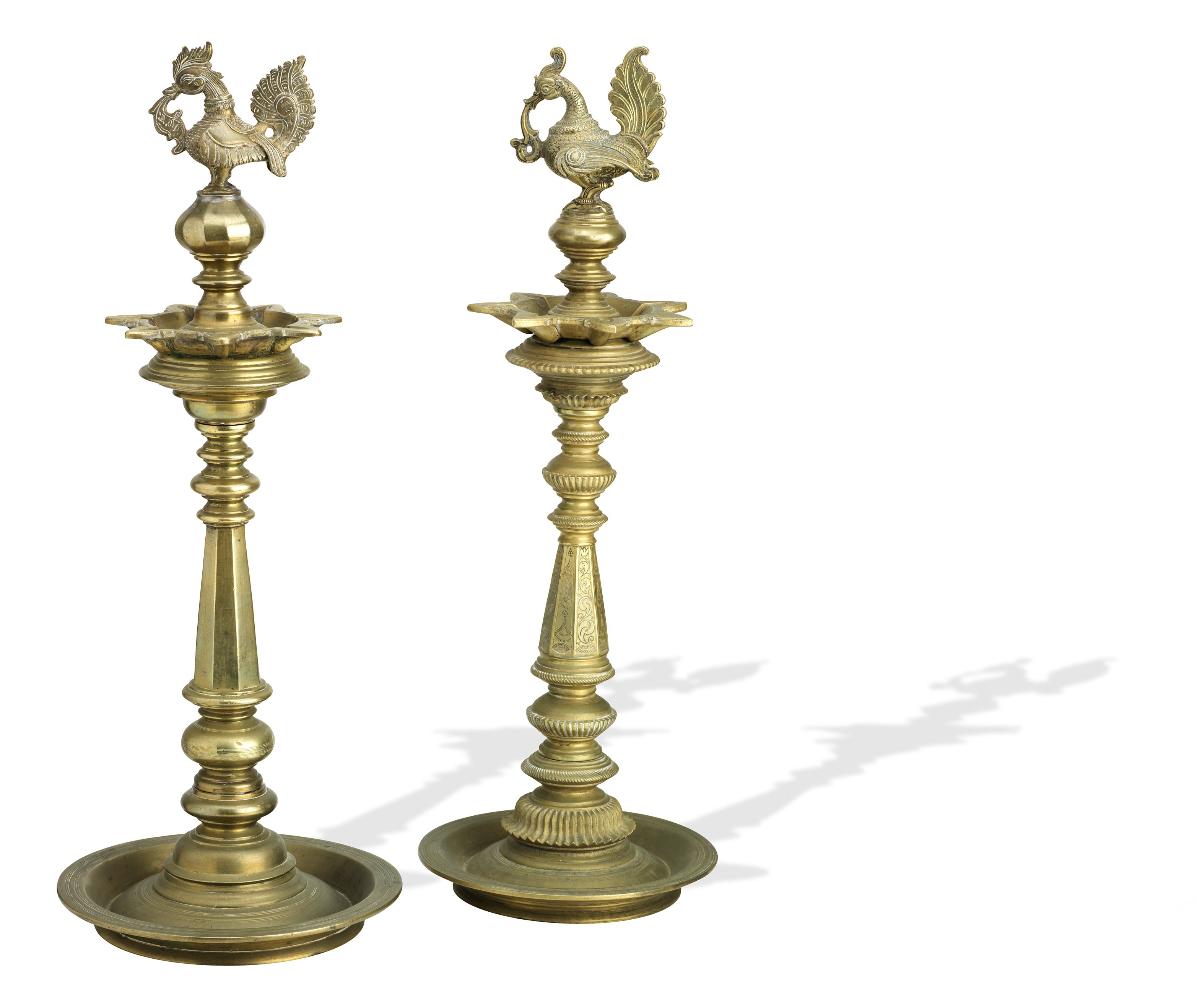 Bonhams Two brass lamp stands with hamsa finials India, 19th/20th