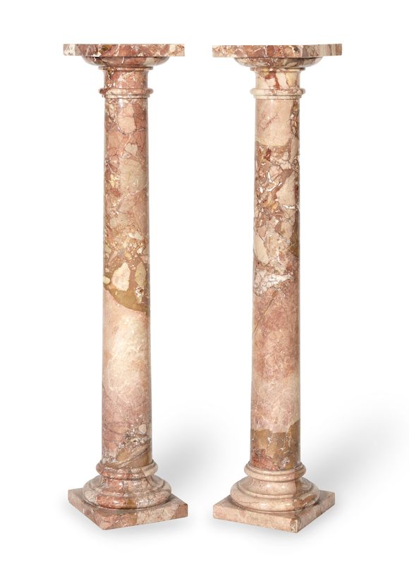 Bonhams : A pair of variegated pink marble column pedestals (2)